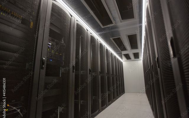 A corridor of server racks in a data centre
