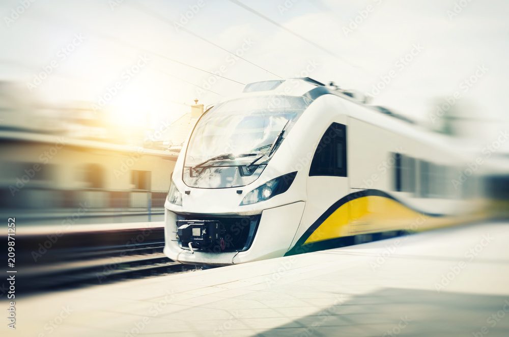 A high-speed train passing through a station